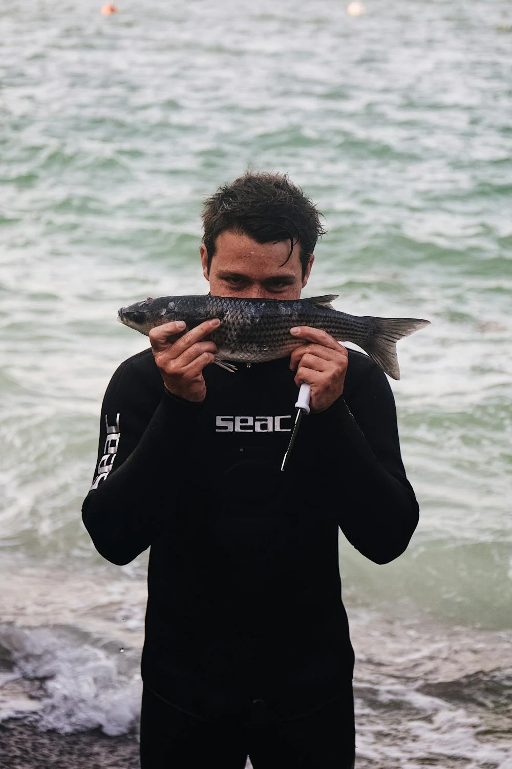 Photo of someone showing their catched fish during a Magic sparefishing charter trip in Lombok