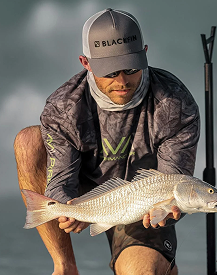 Photo of someone showing a fish they just fished in lombok with magic fishing